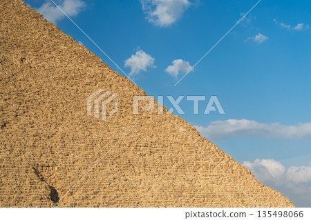 Majestic Great Pyramid of Giza, Egypt Ancient Wonder Against a Stunning Blue Sky, Travel 135498066