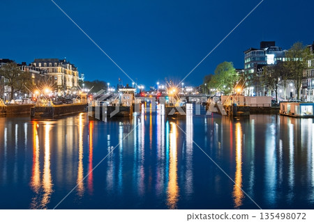 Nighttime Canal Reflections in Amsterdam, Netherlands Cityscape Lights and Water Scenery 135498072