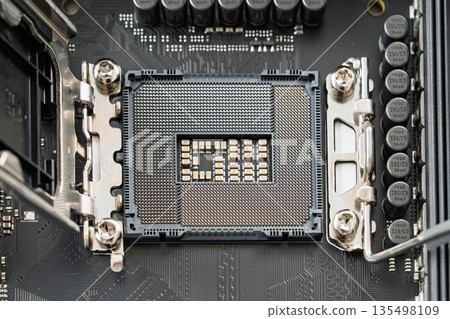 Close-Up of a CPU Socket on a Modern Computer Motherboard, Ready for Processor Installation 135498109