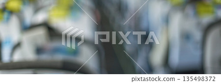 Abstract blurry view inside public transit bus with rows of seats and handrails Abstract blurry view inside public transit bus with rows of seats and handrails 135498372