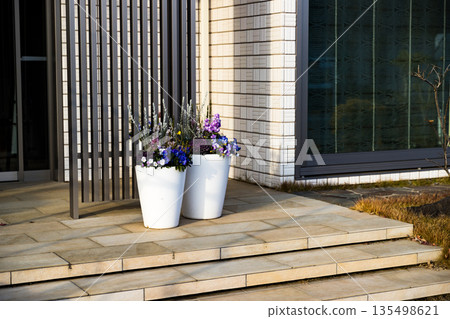 Flower planter on the entrance porch Flower planter on the entrance porch 135498621