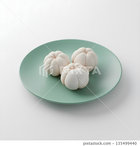 Mangosteen Fruit Arils Three on Green Plate 135499440