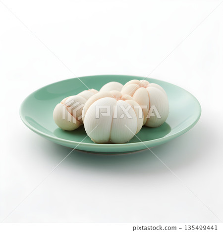 Mangosteen Fruit Arils Three on Green Plate Side View 135499441