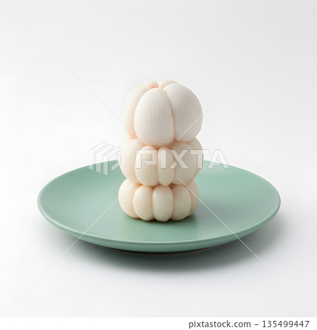 Mangosteen Fruit Arils Stacked on Green Plate 135499447