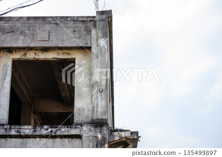 The beauty of the abandoned concrete building and the sky 135499897