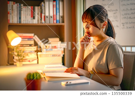 A woman studying 135500339