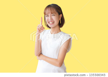 Pointing apron woman Pointing apron woman 135500343