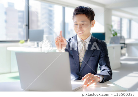 Business man giving his opinion 135500353