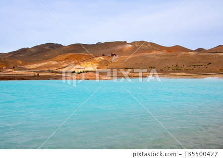 The Blue Lake appears along the main road on the outskirts of Reykjahlid, a town in the northern part of the Nordic island nation of Iceland. 135500427