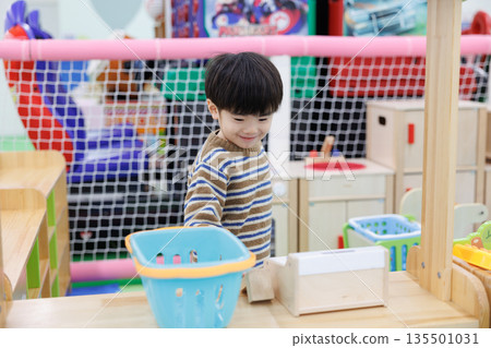 Boy playing house Boy playing house 135501031
