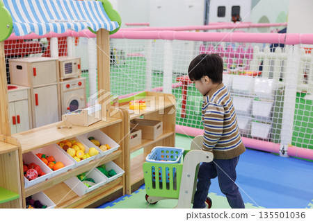 Boy playing house Boy playing house 135501036