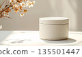 Ceramic canisters arranged on a beige background 135501447