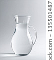 Glass pitcher on a pale gray background 135501487