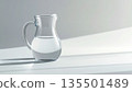Glass pitcher on a pale gray background 135501489