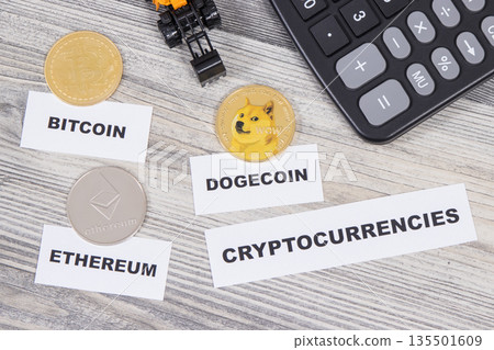 Cryptocurrency coins, miniature excavator and calculator Cryptocurrency coins, miniature excavator and calculator 135501609