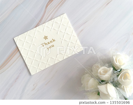 Thank you message card and white bouquet Thank you message card and white bouquet 135501696