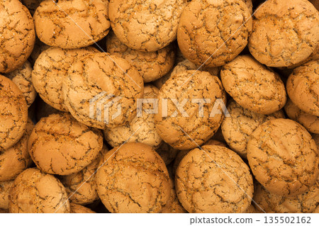 Cookies background. Oatmeal biscuits texture background. Fattening sweets concept Cookies background. Oatmeal biscuits texture background. Fattening sweets concept 135502162