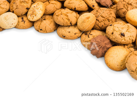Cookies background isolated on white, copy space. Chocolate chips biscuits heap Cookies background isolated on white, copy space. Chocolate chips biscuits heap 135502169