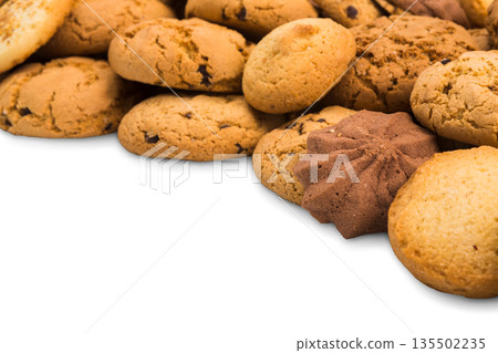 Cookies background frame isolated on white, copy space. Chocolate chips biscuits heap Cookies background frame isolated on white, copy space. Chocolate chips biscuits heap 135502235