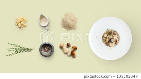 Cooking italian food, risotto with wild mushrooms, isolated on yellow background. Rice, fungus, sauce, parmesan and other ingredients around plate with dish ready Cooking italian food, risotto with wild mushrooms, isolated on yellow background. Rice, fungus, sauce, parmesan and other ingredients around plate with dish ready 135502347