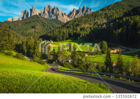 Amazing Funes valley with green fields and spectacular cliffs, Dolomites 135502672