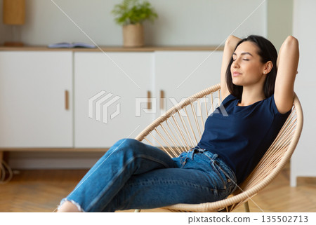 Weekend Relaxation. Peaceful Woman Sitting In Cozy Modern Chair With Eyes Closed Resting And Relaxing At Home. Copy Space 135502713
