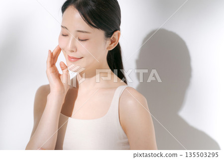 A young woman doing skin care 135503295