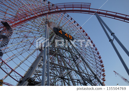 Yokohama Minato Mirai Ferris wheel with blue sky in the background Yokohama Minato Mirai Ferris wheel with blue sky in the background 135504769