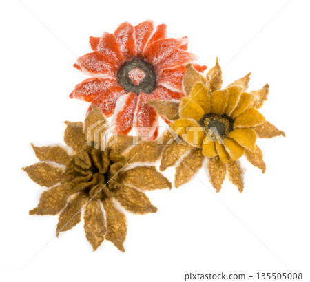 Three flowers from felted wool on a white background 135505008