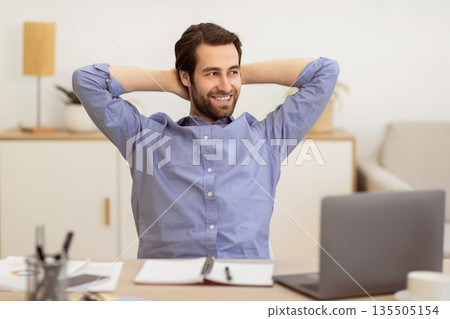 Carefree Businessman Relaxing Sitting Holding Hands Behind Head At Workplace In Office. Cheerful Entrepreneur Resting Sitting At Laptop. Successful Business Career Concept Carefree Businessman Relaxing Sitting Holding Hands Behind Head At Workplace In Office. Cheerful Entrepreneur Resting Sitting At Laptop. Successful Business Career Concept 135505154