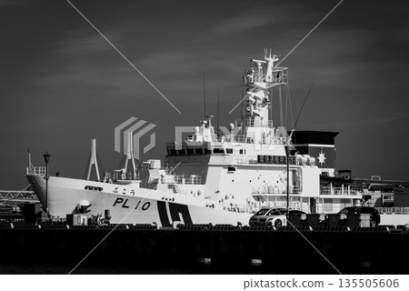 Clear skies at Yokohama Port and a Japan Coast Guard patrol boat 135505606