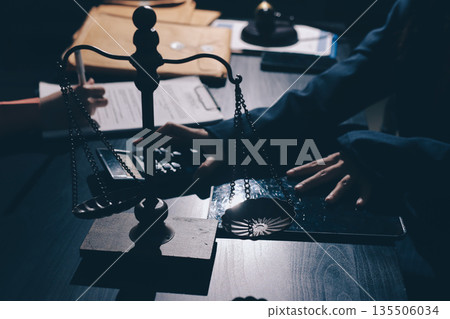 Consultation and conference of professional businesswoman and Male lawyers working and discussion having at law firm in office. Concepts of law, Judge gavel with scales of justice Consultation and conference of professional businesswoman and Male lawyers working and discussion having at law firm in office. Concepts of law, Judge gavel with scales of justice 135506034