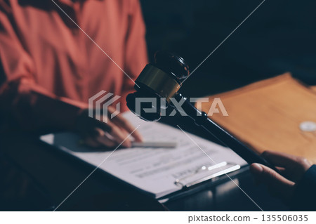 Consultation and conference of professional businesswoman and Male lawyers working and discussion having at law firm in office. Concepts of law, Judge gavel with scales of justice 135506035