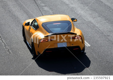 Image of a yellow domestic sports car Image of a yellow domestic sports car 135507921