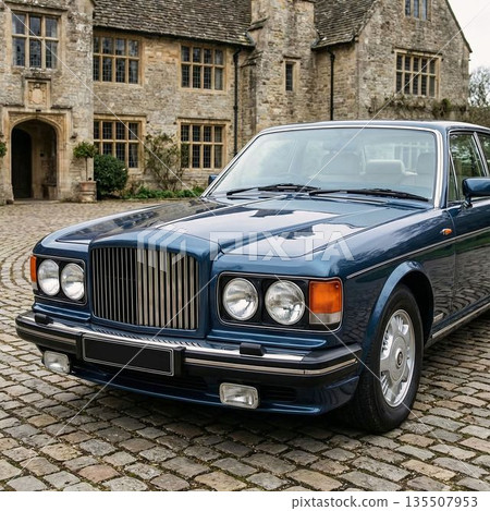 Old building and car parked on cobblestone road 135507953