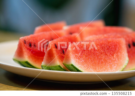 Small watermelons on the dining table Small watermelons on the dining table 135508215