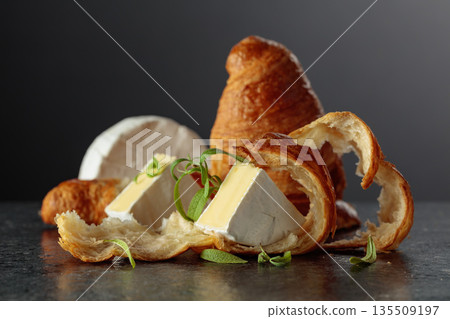 Camembert cream cheese croissants and rosemary. Camembert cream cheese croissants and rosemary. 135509197