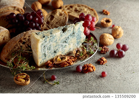 Gorgonzola with ciabatta, walnuts, red grapes, and thyme. Gorgonzola with ciabatta, walnuts, red grapes, and thyme. 135509200