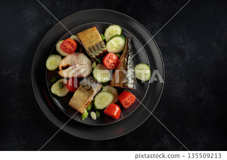 Smoked mackerel with fresh cucumbers, tomatoes and green onion. Smoked mackerel with fresh cucumbers, tomatoes and green onion. 135509213