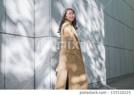 A woman in a coat A woman in a coat 135510225