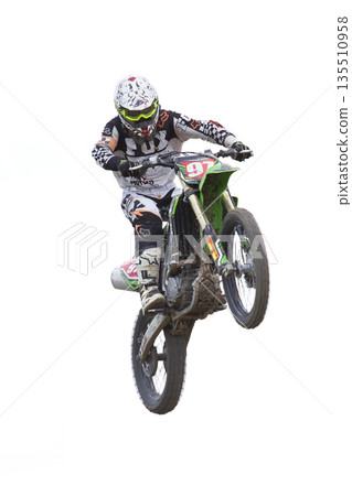 Racer while jumping a quad bikeon a white background. Racer while jumping a quad bikeon a white background. 135510958