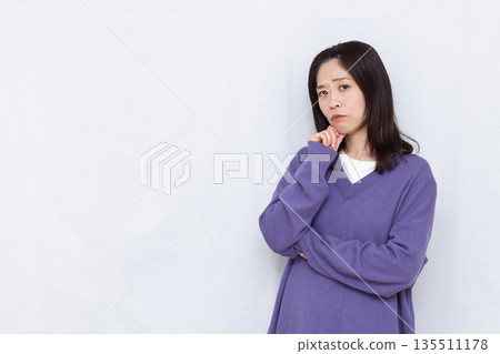 A woman who is seriously worried 135511178