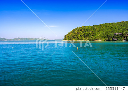 Panoramic view of the turquoise sea and lush green coastline of Koh Samed, Rayong, Thailand Panoramic view of the turquoise sea and lush green coastline of Koh Samed, Rayong, Thailand 135511447