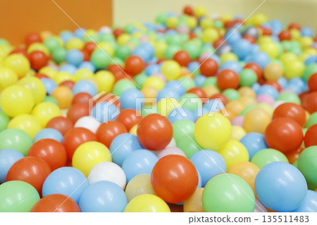 Colorful ball pool. Indoor kids playground background. Colorful ball pool. Indoor kids playground background. 135511483