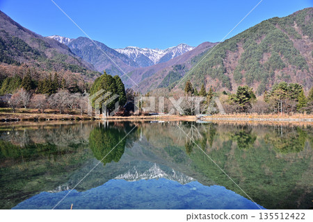 Senjojiki Cirque in the Central Alps reflected in Komagaike Pond 135512422