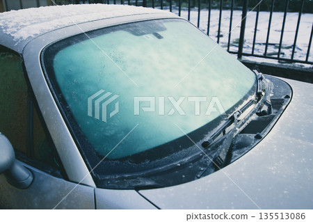 Frozen car windshield Frozen car windshield 135513086