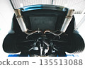 Sports car muffler seen from below 135513088
