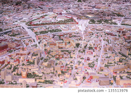Detailed miniature model represents the intricate urban landscape of Moscow, highlighting various buildings, roads, and green spaces in a captivating layout. Detailed miniature model represents the intricate urban landscape of Moscow, highlighting various buildings, roads, and green spaces in a captivating layout. 135513976