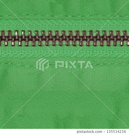 Zipper of green jeans. Close-up of women's jeans, jeans with a zipper. Jeans concept, casual wear concept. Zipper of green jeans. Close-up of women's jeans, jeans with a zipper. Jeans concept, casual wear concept. 135514216