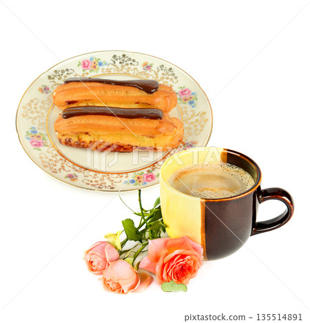 Gourmet Eclairs on Ornate Plate with Steaming Cup of Coffee 135514891